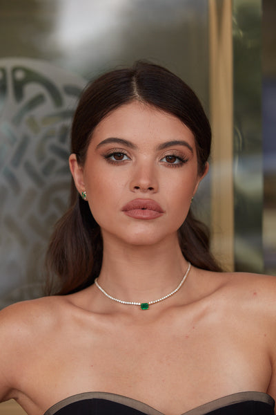 Emerald & Diamond Tennis Necklace In 18K Yellow Gold - Tresor Collection Lifestyle view of 18K gold emerald and diamond necklace – sophisticated handcrafted jewelry by Tresor Collection