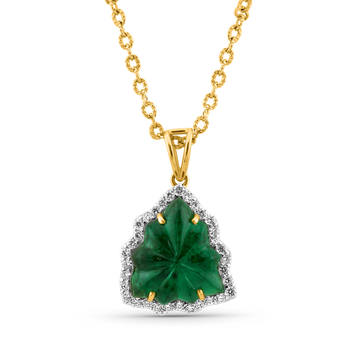 emerald-diamond pendant, carved in leaf shape with 4 prones only in 18kt yellow gold with v shape loop by tresor collection the best designer jewelry store in miami. 18K gold emerald pendant flatlay – luxury fine jewelry by Tresor Collection