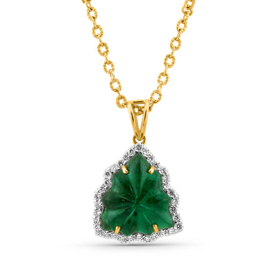 emerald-diamond pendant, carved in leaf shape with 4 prones only in 18kt yellow gold with v shape loop by tresor collection the best designer jewelry store in miami. 18K gold emerald pendant flatlay – luxury fine jewelry by Tresor Collection