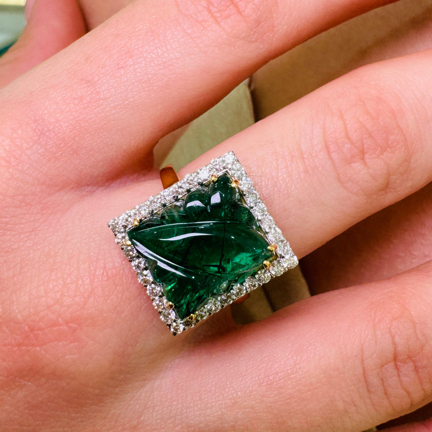 Woman wearing Dazzle Emerald and Diamond Eternity Ring in 18k Gold for wedding wear Emerald and diamond gold ring styled for festive occasion – fine handcrafted jewelry by Tresor Collection