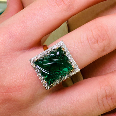 Woman wearing Dazzle Emerald and Diamond Eternity Ring in 18k Gold for wedding wear Emerald and diamond gold ring styled for festive occasion – fine handcrafted jewelry by Tresor Collection