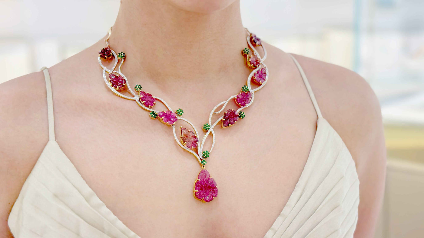 Tourmaline Carved Leaves, Emerald & Diamond Necklace In 18K Yellow Gold - Tresor Collection Elegant ruby and emerald necklace worn on model – handcrafted statement jewelry for formal occasions