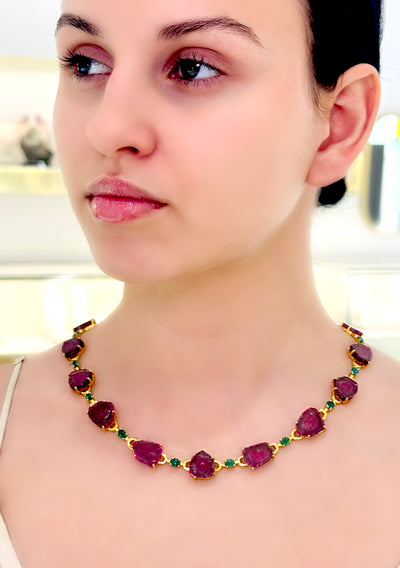 Emerald Oval & Watermelon Tourmaline U/S Necklace In 18K Yellow Gold - Tresor Collection Gold necklace with bi-color tourmaline gemstones worn on model – vibrant pink-green gemstone design