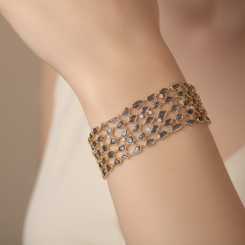 Gold bracelet on a person's wrist against a neutral background Close-up of diamond wide bracelet on wrist – elegant luxury jewelry styling