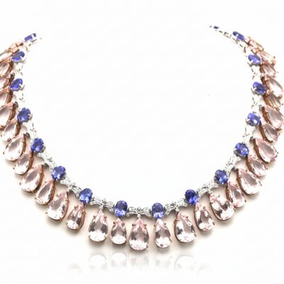 Necklace with teardrop-shaped crystals on a white background 18K rose gold Morganite and Tanzanite necklace flatlay – luxury fine jewelry by Tresor Collection