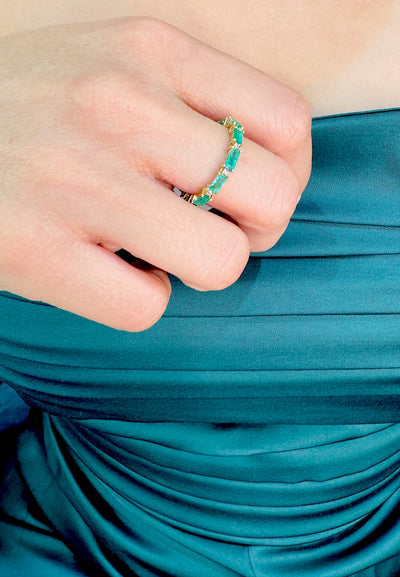 Emerald Rectangle And Diamond Ring In 18K Yellow Gold - Tresor Collection Styled shot of emerald eternity band ring on model – modern elegant fine jewelry