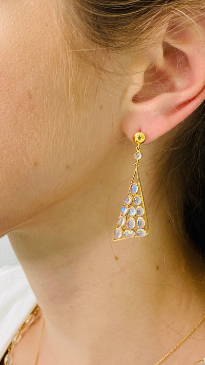Rainbow Moonstone And Diamond Earring In 18K Yellow Gold - Tresor Collection Close-up of 18K gold geometric earrings with blue gemstones – contemporary fine jewelry design