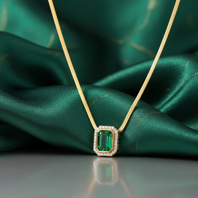 Gold necklace with a green gemstone necklace photoshoot from tresor collection