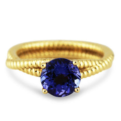 18K gold Tanzanite round ring – handcrafted blue gemstone fine jewelry Gold tanzanite ring front view – showcasing an elegant design with a vibrant blue gemstone.