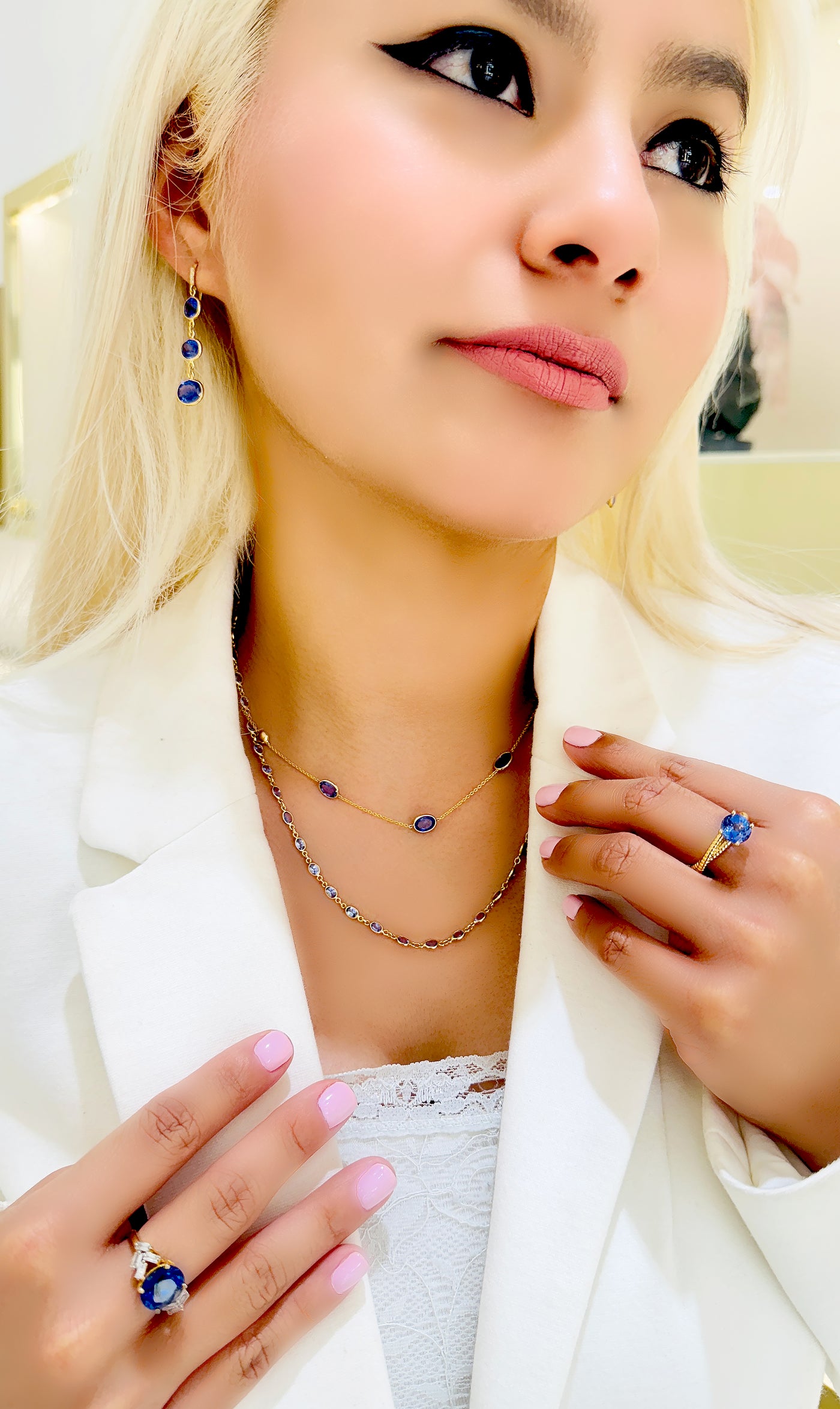 Model wearing gold tanzanite ring on hand – showcasing how the ring looks in real-life wear.