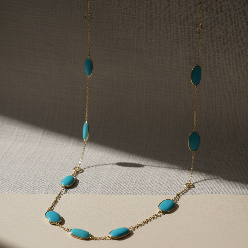Necklace with turquoise beads on a neutral background 18K yellow gold turquoise necklace close-up – modern classic jewelry by Tresor Collection