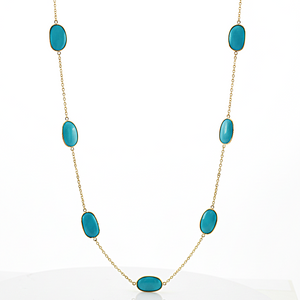 Turquoise stone necklace on a white background 18K gold turquoise necklace flatlay – handcrafted gemstone jewelry by Tresor Collection