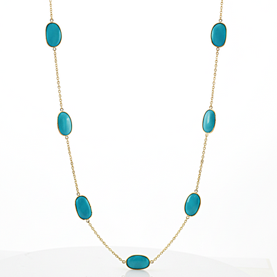 Turquoise stone necklace on a white background 18K gold turquoise necklace flatlay – handcrafted gemstone jewelry by Tresor Collection