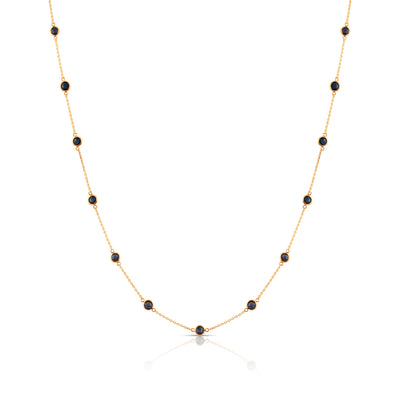 Elegant 18k yellow gold gemstone necklace from the Fin Collection, displayed on white background" Multi-gemstone gold necklace styled for festive and daily wear – luxury handcrafted jewelry by Tresor Collection
