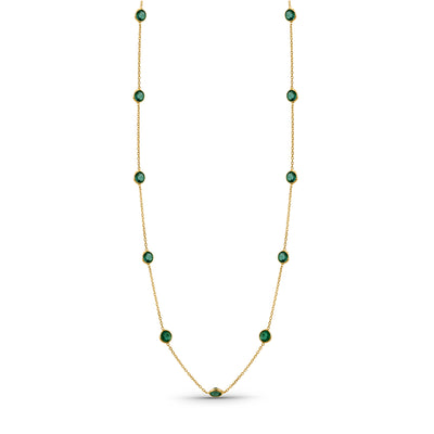Elegant 18k yellow gold gemstone necklace from the Fin Collection, displayed on white background" Close-up of 18K gold ruby, emerald, sapphire & turquoise necklace – handcrafted fine jewelry from Tresor Collection