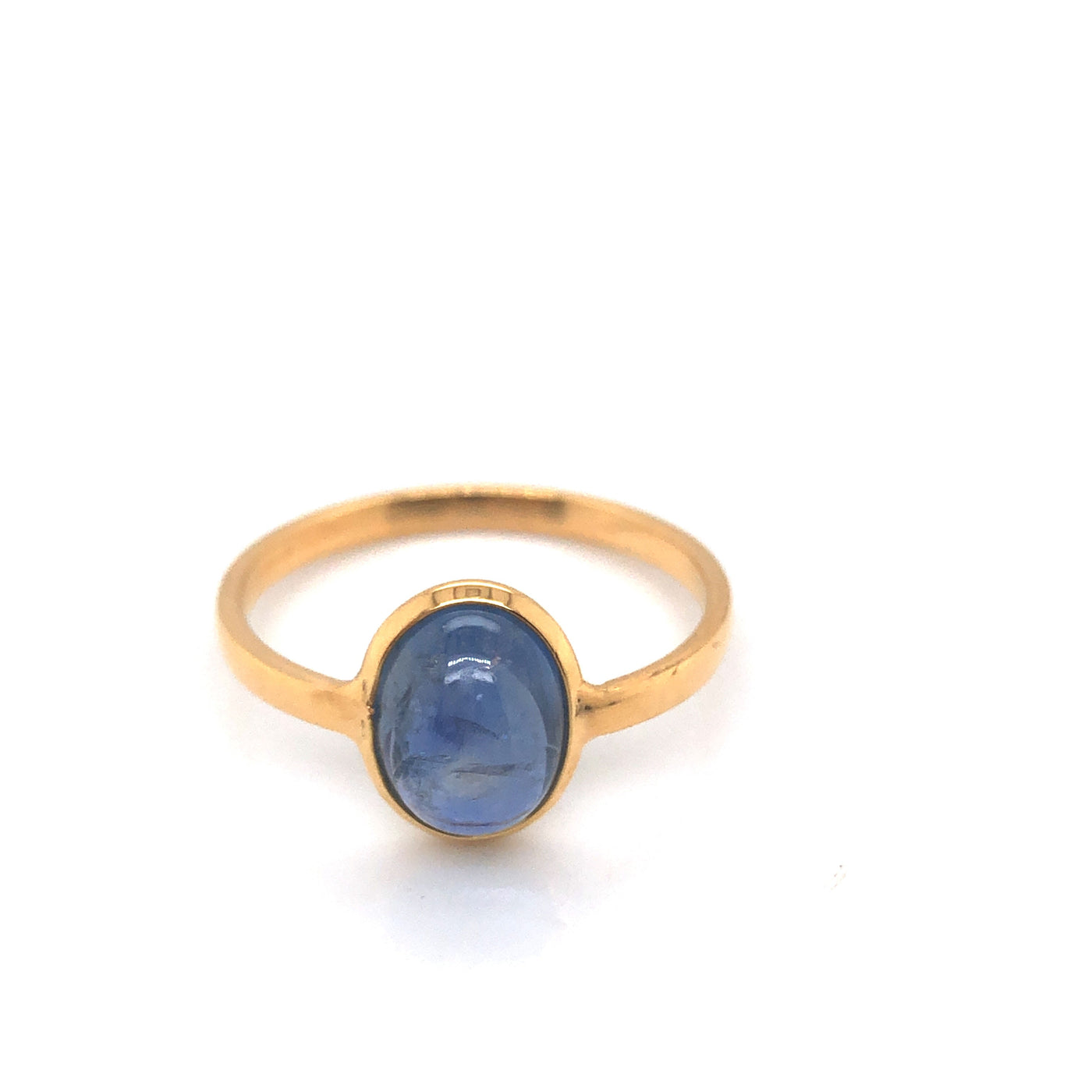 18K Gold Blue Sapphire Ring by Tresor Collection 18K gold Blue Sapphire solitaire ring flatlay – handcrafted fine jewelry by Tresor Collection