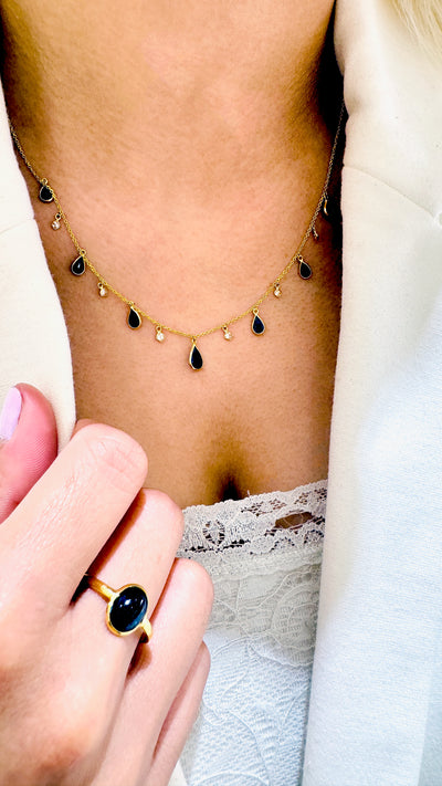 Blue Sapphire Oval Ring In 18K Yellow Gold - Tresor Collection Blue Sapphire solitaire ring on jewelry stand – fine handcrafted 18K gold gemstone ring