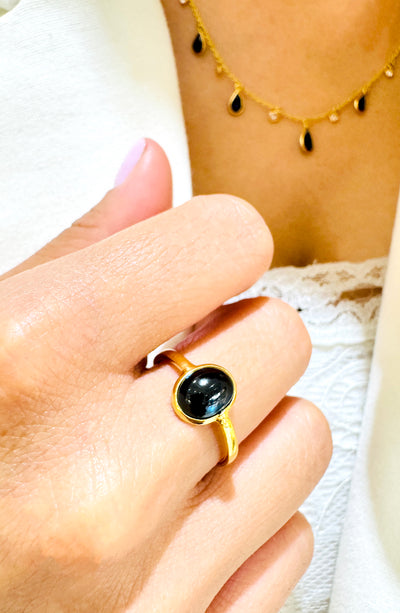 Blue Sapphire Oval Ring In 18K Yellow Gold - Tresor Collection Elegant Blue Sapphire solitaire ring worn on hand – luxury handcrafted gold gemstone jewelry
