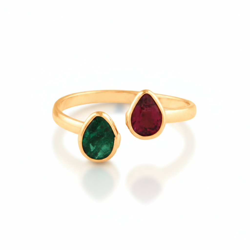 A ring with a pear-shaped ruby and emerald gemstone, both in yellow gold settings.