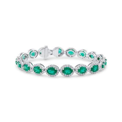 18K White Gold Emerald & Diamond Oval Bracelet by Tresor Collection White gold oval-cut emerald bracelet flatlay – elegant green gemstone jewelry by Tresor Collection