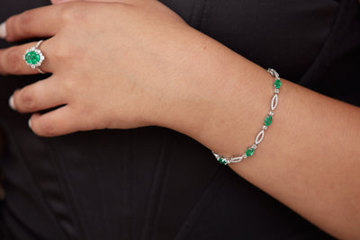 Emerald Oval & Diamond Bracelet In 18K White Gold - Tresor Collection Emerald and diamond tennis bracelet on wrist – luxury handcrafted jewelry by Tresor Collection