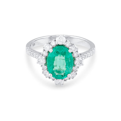 18K White Gold Emerald & Diamond Oval Ring by Tresor Collection Oval-cut emerald and diamond halo ring in 18K white gold – fine handcrafted jewelry by Tresor Collection