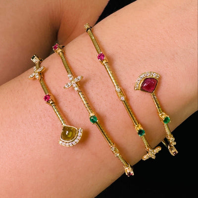 Multicolor Gemstone & Diamond 3 Row Symphony Bracelet In 18K Yellow Gold - Tresor Collection Close-up of multi-gemstone bangle bracelet on arm – luxury gold jewelry styling by Tresor Collection