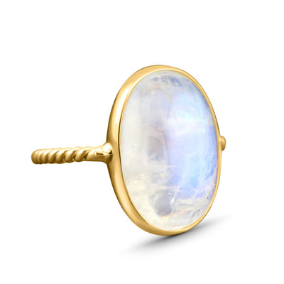 Rainbow Moonstone Oval Ring In 18K Yellow Gold - Tresor Collection Detailed shot of 18K gold moonstone ring, showcasing the intricate craftsmanship and luminous finish of the stone.