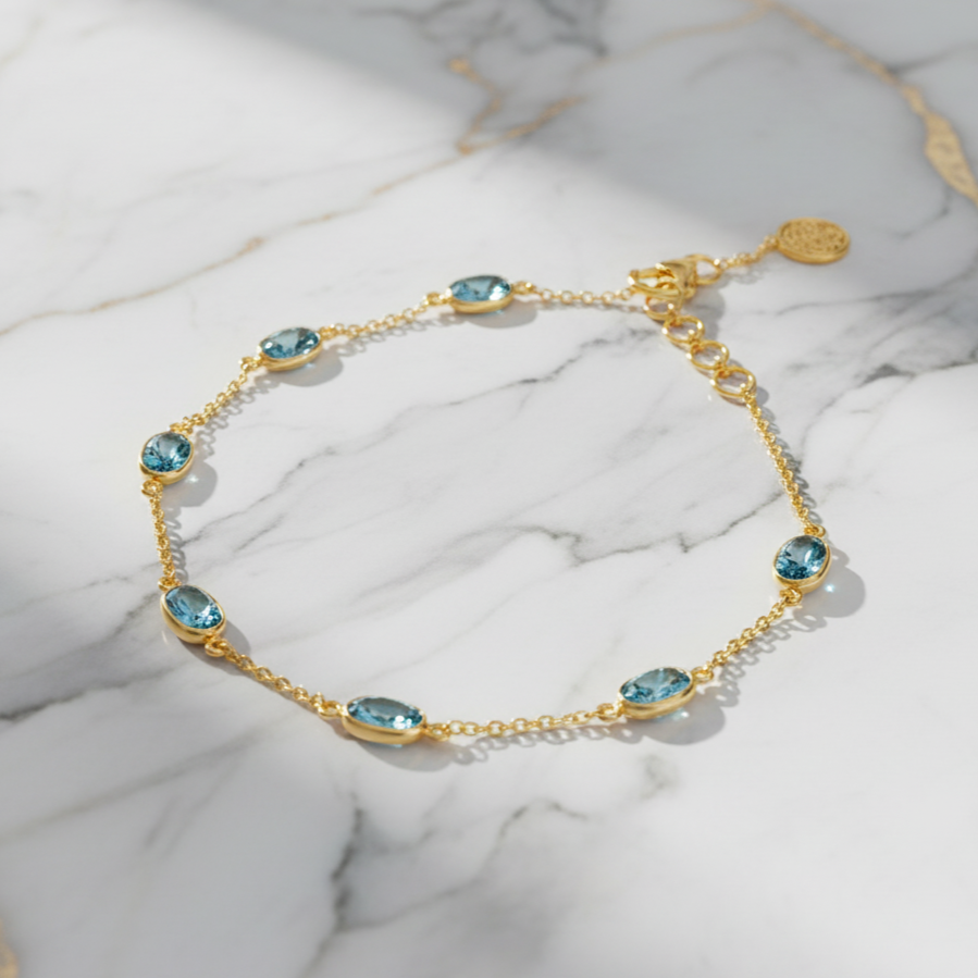 Aquamarine gold station bracelet in 18K yellow gold – flatlay view by Tresor Collection
18k yellow gold station bracelet with bezel-set aquamarine gemstones from the Tresor Collection- the best designer jewelry collection.
Gemstone Bracelet,
carved Gemstone Bracelet
Bracelet By Tresor