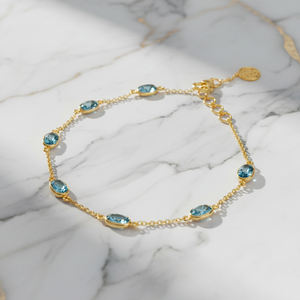 Aquamarine gold station bracelet in 18K yellow gold – flatlay view by Tresor Collection
18k yellow gold station bracelet with bezel-set aquamarine gemstones from the Tresor Collection- the best designer jewelry collection.
Gemstone Bracelet,
carved Gemstone Bracelet
Bracelet By Tresor