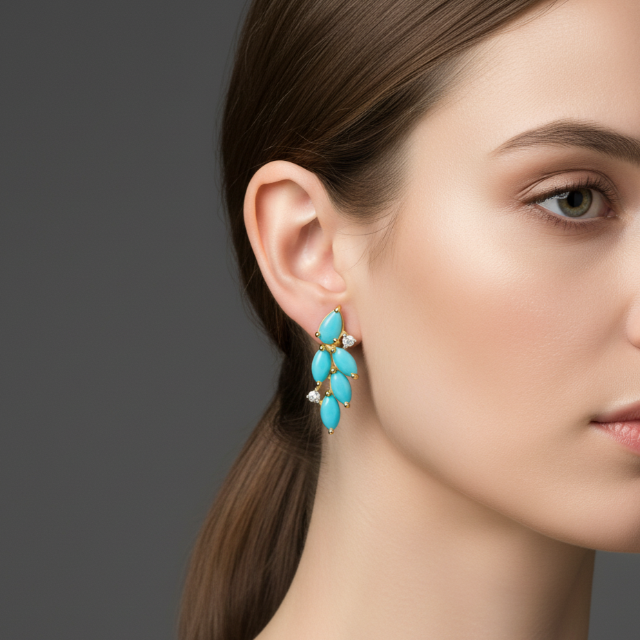 Close-up of a woman wearing turquoise earrings with a gray Elegant turquoise and diamond gold earrings on model – designer fine jewelry for women by Tresor Collectionbackground