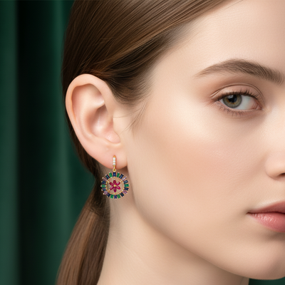 Close-up of a woman wearing a colorful earring with a green background Elegant multicolor gemstone floral earrings on model – designer fine jewelry for women by Tresor Collection