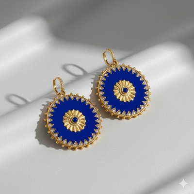 Lapis lazuli gold earrings styled with blue dress – statement luxury jewelry for women by Tresor Collection